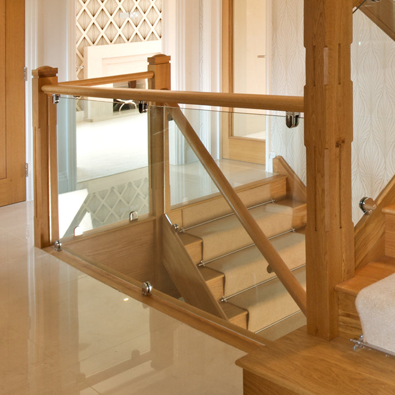 Glass and rounded oak staircase by Staircase Parts