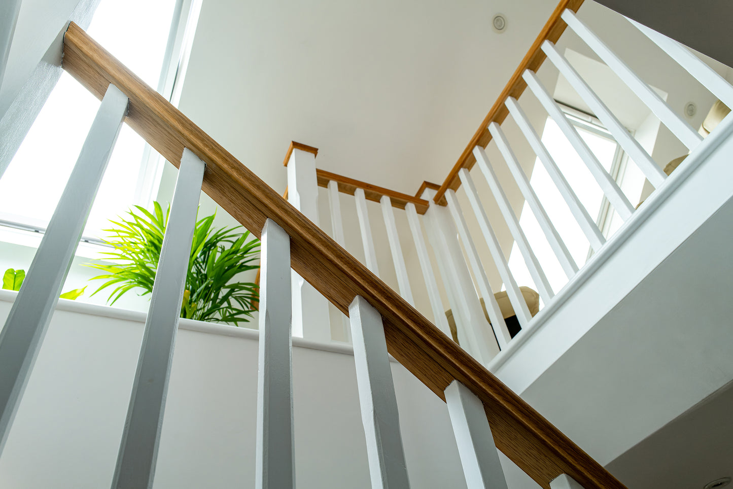 Modern white staircase parts installed